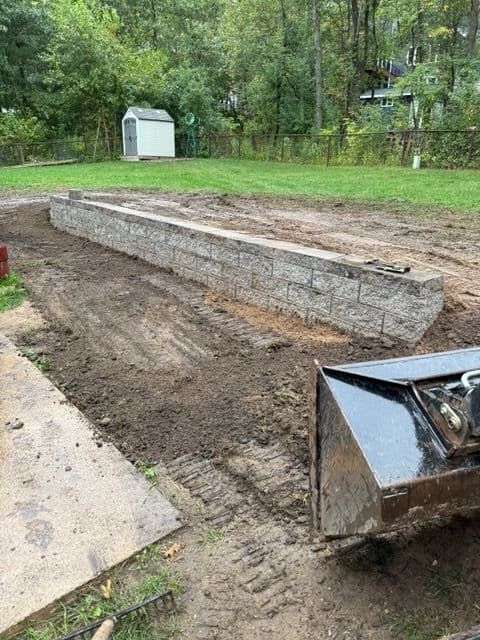 New Stone Retaining Wall and Hydroseeding Project image