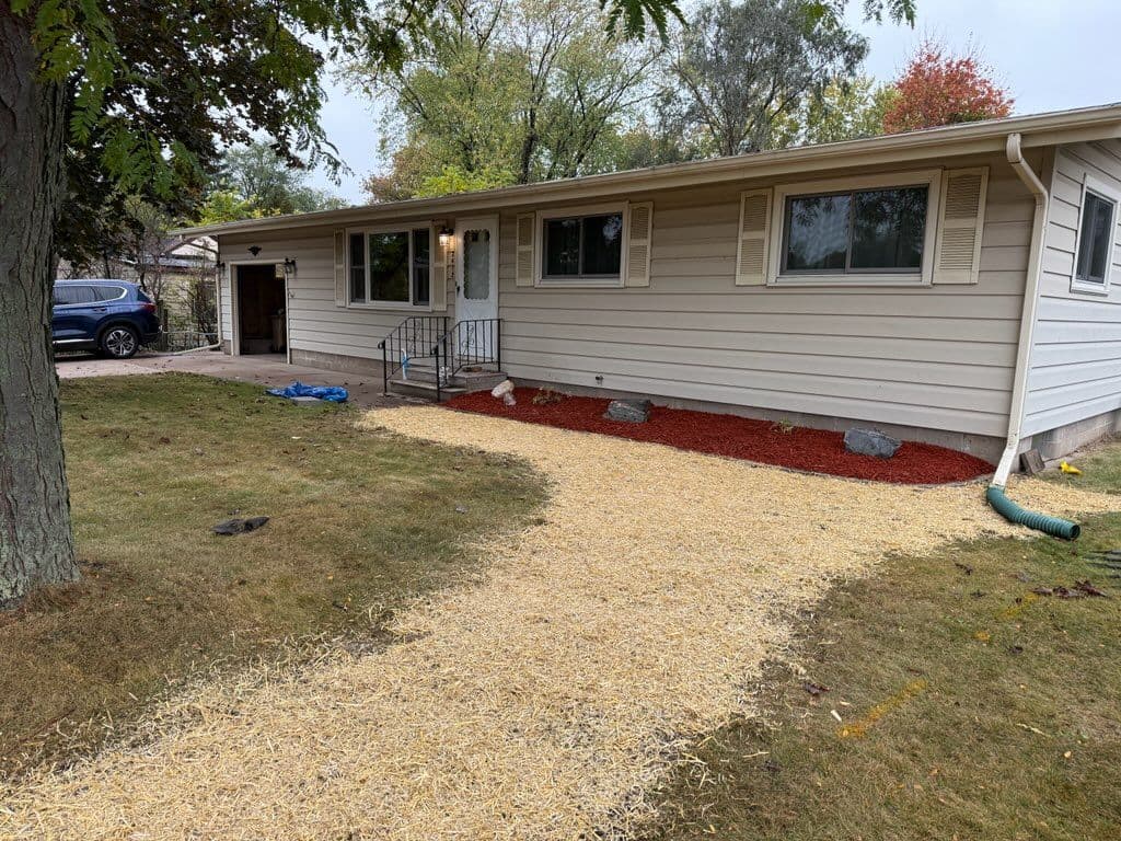 Backyard Makeover with Stone Edging and Red Mulch