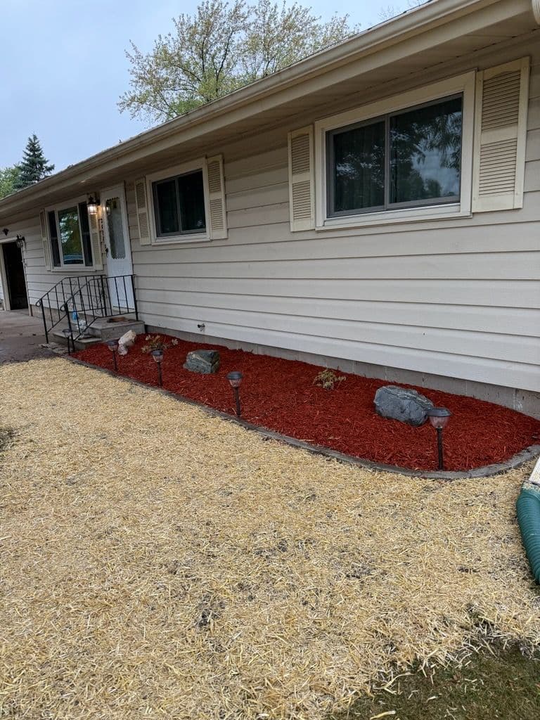 Backyard Makeover with Stone Edging and Red Mulch