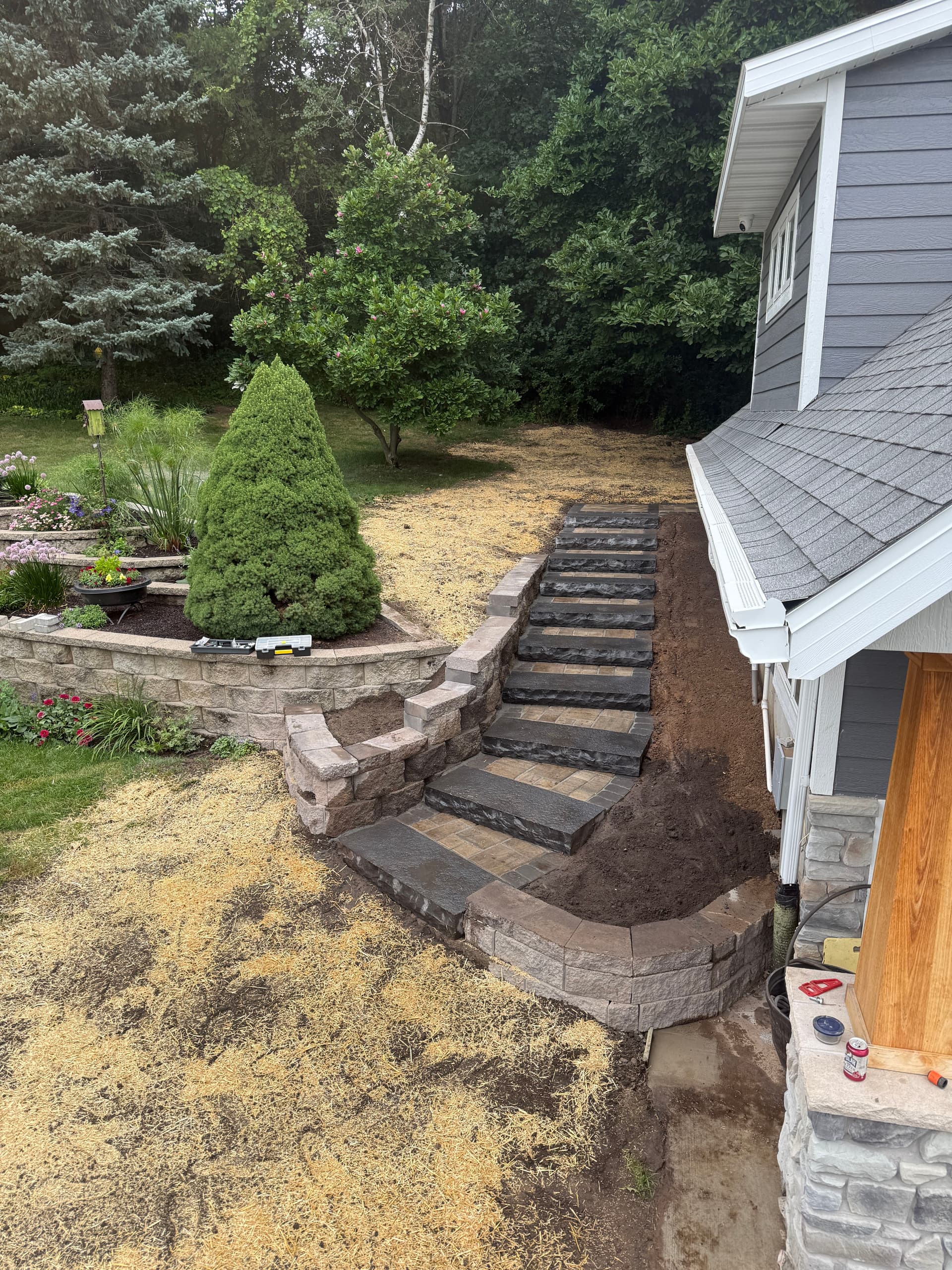 Sloped Entrance Gets a Full Step and Retaining Wall Rebuild image